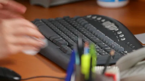 Manager wipes keyboard from dust Stock Footage 30619578
