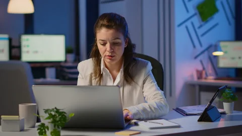 Manager woman using laptop and tablet in same time working overtime Video stock 146173853