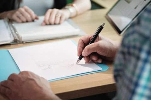 Manager Working As Banking Broker With Old Man Signing Contract Stock Photos