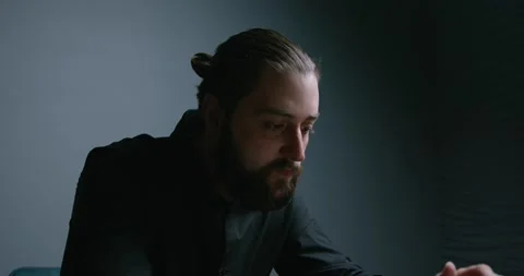 The manager is working hard, thinking hard and nodding in approval. Video stock 137739489