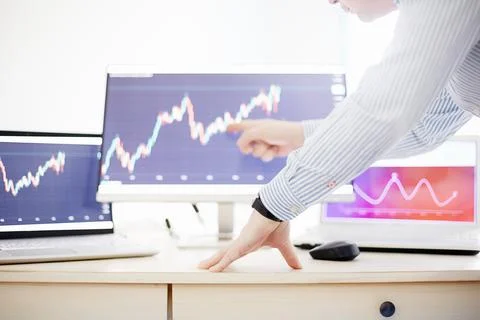 Manager working in office, looking at graphs Stock Photos