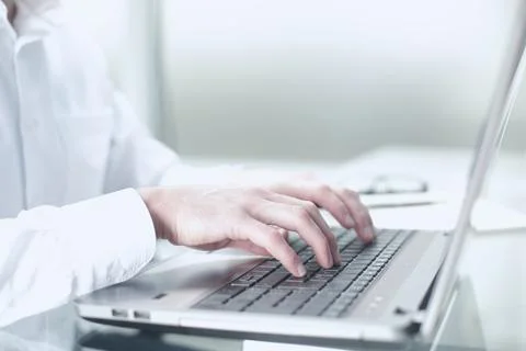 The manager works at the computer in the office. The concept of hard office work Stock Photos