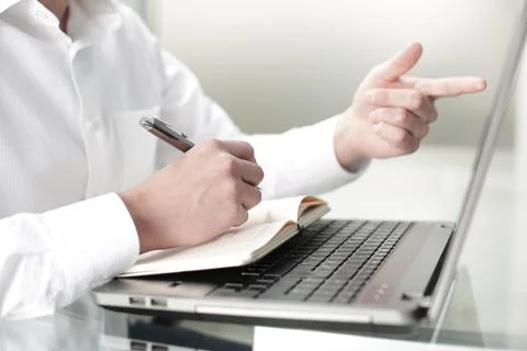 The manager works at the computer in the office Stock Photos