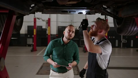 Manager writes down in the tablet what needs to be replaced during the repair Stock Footage 221546349