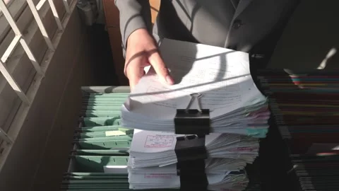 Managers are searching for and managing documents at the office. Stock Footage 148752076