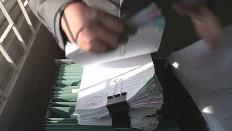 Managers are searching for and managing documents at the office. Video stock 148752128