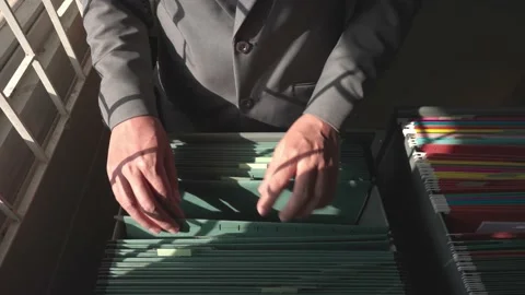 Managers are searching for and managing documents at the office. Video stock 148752215