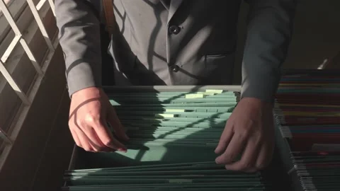 Managers are searching for and managing documents at the office. Stock-Footage 148752223