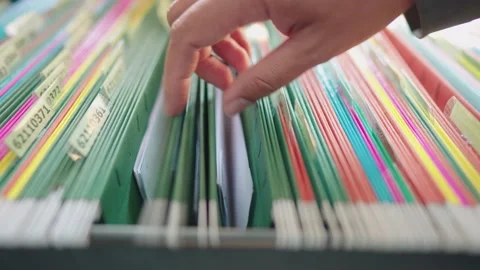 Managers are searching for and managing documents at the office. Stock Footage 148752270