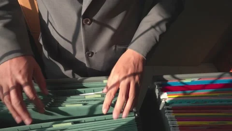 Managers are searching for and managing documents at the office. Stock Footage 148752290
