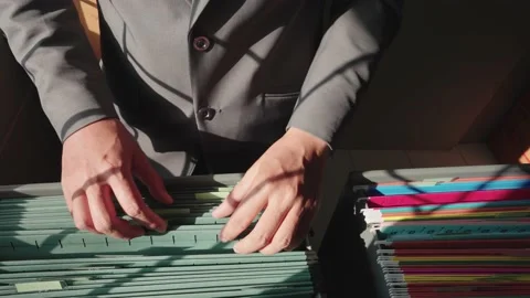 Managers are searching for and managing documents at the office. Stock Footage 148752324