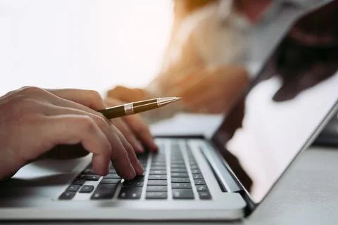 Managers are using fingers to typing personal information of employees who .. Stock Photos
