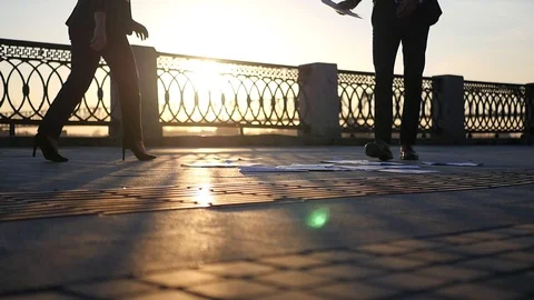 Managers collect paper from the floor at sunset. HD, 1920x1080, slow motion Stock Footage 114601429