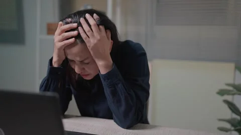 Managers feel stressed and headaches from their workload and have many loans tha Stock Footage 262850122