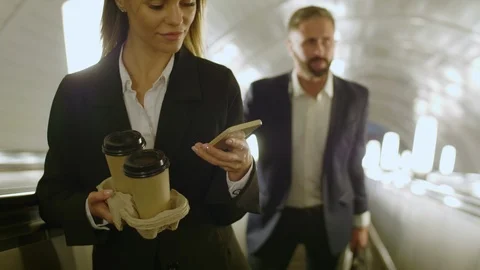 Managers going up on escalator in subway 스톡 동영상 120664464