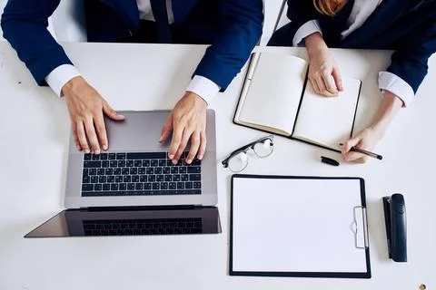 Managers laptop and documents on the table technology Stock Photos