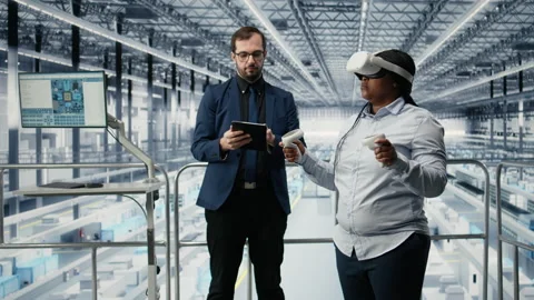 Managers in microchip smart factory using VR glasses gear to develop electronics Stock Footage 333381977