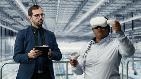 Managers in microchip smart factory using VR glasses gear to develop electronics Stock Footage 333387764