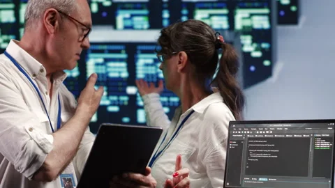 Managers running code in data center Stock Footage 249969623