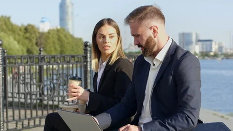 Managers in suits working outside office buildings in summer Stockbeeldmateriaal 120666066