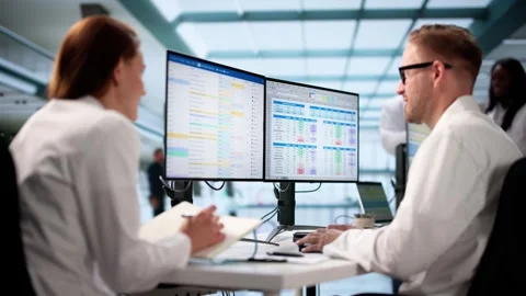 Managing Hospital Billing. Medical Coding Administrator Editing Invoices Stock Footage 311178246