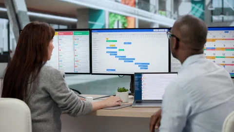 Managing Software Tasks In Busy Office Stock Footage 331521775