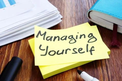 Managing yourself. Office table with papers. Self management concept. Stock Photos