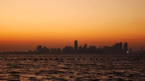 Manama Bahrain skyline and dramatic sky during sunset Stock Footage 116506223