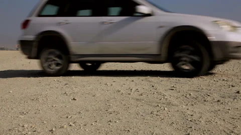 Manama Skyline from the desert a Car crossing the frame Stock Footage 59738059