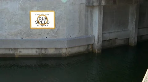 Manatee Zone boating sign on Florida canal, 4K Stock Footage 50144658