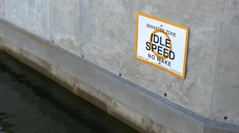 Manatee Zone boating sign on Florida canal, WIDE, 4K Stock Footage 50144722