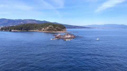 Manazuru Cape Aerial Pull Back│Mitsuishi Rocks Reveal Stock Footage 329058090
