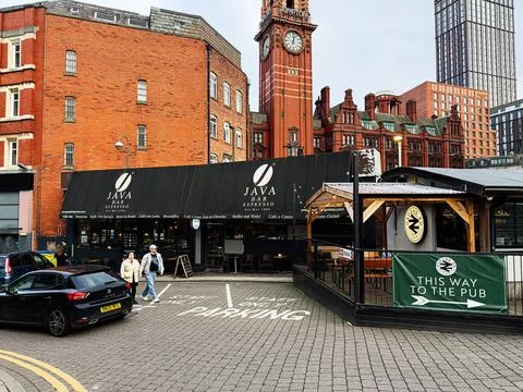 Manchester Java Bar Espresso with brick buildings and clock tower creating .. Fotos Stock