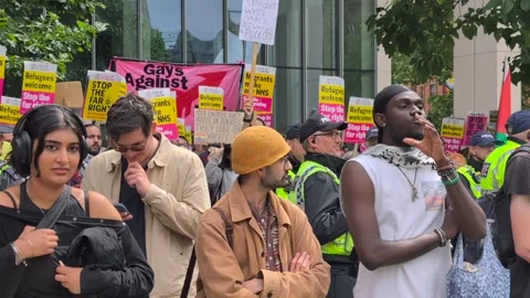 Manchester, UK, August 2, 2025 counter-protestors and protestors face-off. Stock Footage 314371648