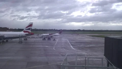 Manchester, UK, October 1, 2024: Airplanes taxiing on the tarmac Stock Footage 304972453