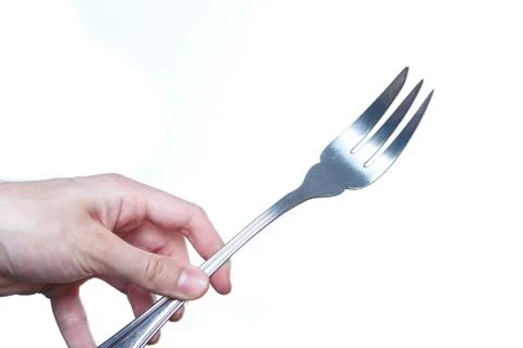Mand holding a giant fork. Devil in the kitchen concept. Stock Photos