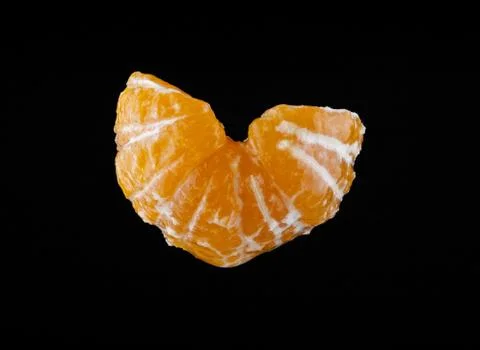 Mandarin on a black background closeup Stock Photos