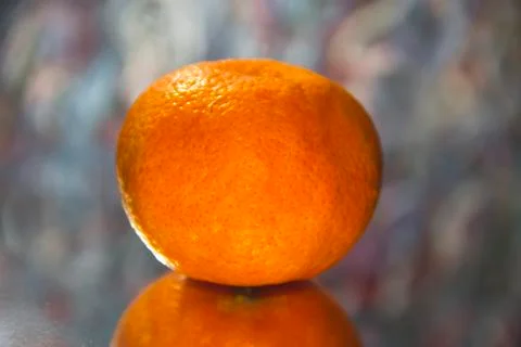 Mandarin closeup on an abstract background. Stock Photos