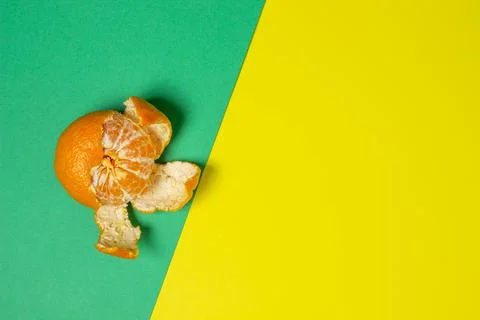 Mandarin on a colored background. Citrus fruit. Mandarin on a geometric paper ba Stock Photos