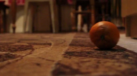 Mandarin falls to the floor Stock Footage 60119350