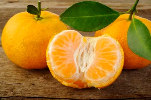 Mandarin fruit on rustic wooden background Stock Photos