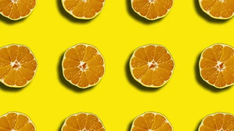 Mandarin geometric pattern on a yellow background. Simple motion graphics nature Stock Footage 147151440