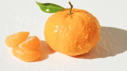 Mandarin or clementine and cloves with green leaf isolated on white background.  Stock Footage 263242307