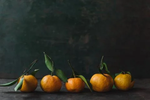 Mandarin orange on rustic background Stock Photos