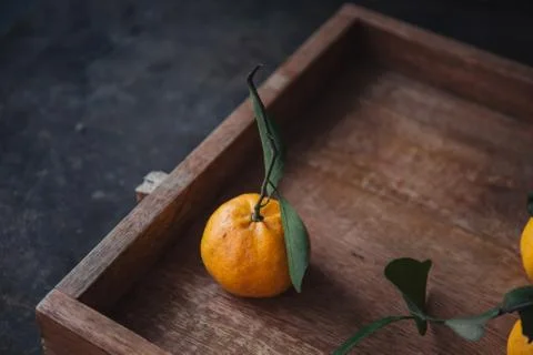 Mandarin orange on rustic background Stock Photos