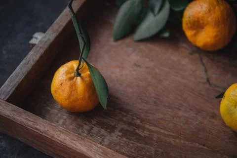 Mandarin orange on rustic background Stock Photos