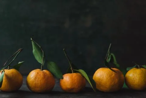 Mandarin orange on rustic background Stock Photos