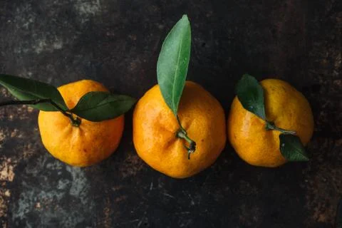 Mandarin orange on rustic background Stock Photos