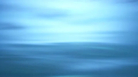 Mandarin orange segments falling into water Stock Footage 8572506