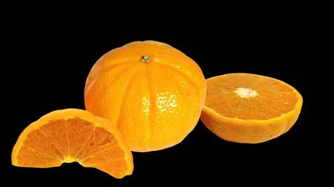 Mandarin orange with sliced segments on black background. Stock Photos